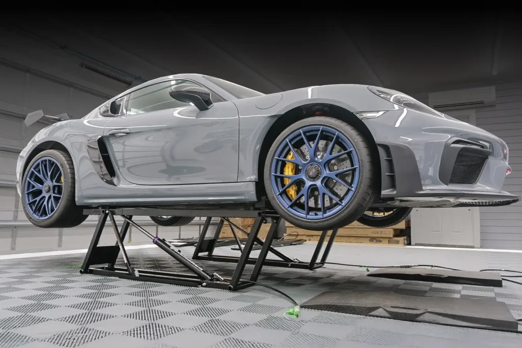 QucikJack portable lift with Porsche & gridflex garage floor